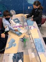 Students painting snowscapes